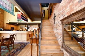 Stairs to loft above dining room and kitchen. 