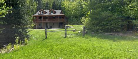 Mountain-side cabin in late spring.