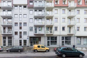 Modern property building situated close to the park, where the guests can relax.