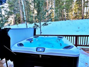 Private hot tub nestled in the pines