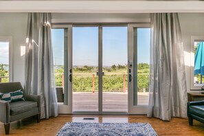 Doors to the 2nd floor deck with beautiful views of the bay and wetlands 