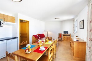 Prepare meals in the kitchenette and enjoy them at the dining table.