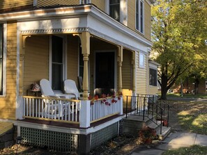 The side porch is the perfect place to enjoy a view of the sunset. 