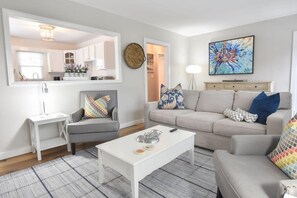 Living area with window to kitchen