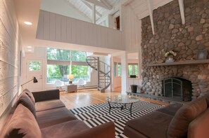 Living Room with stone fireplace. We provide  Fire Wood
