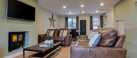 A modern open plan lounge with dining area.