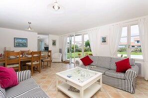 Sit back in the cozy living area and watch a movie on the satellite TV.