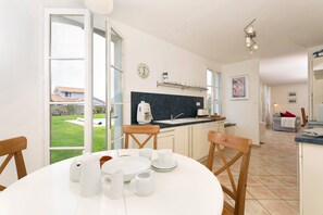 Prepare meals in the kitchenette and enjoy them at the dining table.