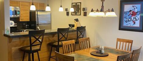 Main Dining Area & Kitchen Space in Background