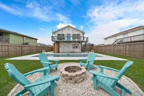 Immerse yourself in relaxation by our outdoor pool, surrounded by ample spaces and a cozy firepit