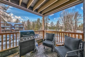 Grill out or relax under this covered balcony with seating for 4 and a gas BBQ