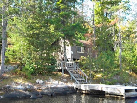View of dock leading to deck and cabin