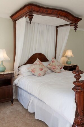 The antique bed in the Floral bedroom