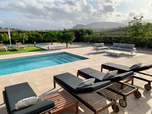 View of the pool and the mountains from the patio doors of bedroom 3 (Master)