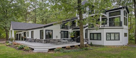 Front and east side of house with fire pit.