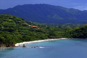 View of the hillside and beach where we are located