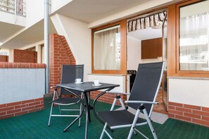 A balcony with garden furniture creates space for spending time outdoors.