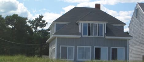 Front of house facing beach and ocean, taken from beach
