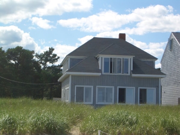 Front of house facing beach and ocean, taken from beach
