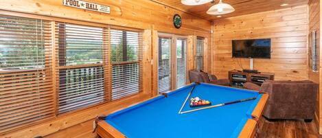 Rack 'em up! Get ready for some friendly competition with our top-notch pool table at Mountain Creek Lodge