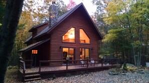 Chalet at twilight in autumn.