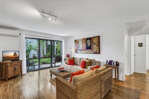 Loungroom looking out to the lush tropical gardens