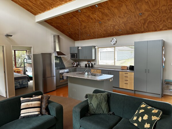 Open plan entertainers kitchen featuring island bench