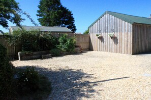 Private area to front of Barn with picnic bench.  