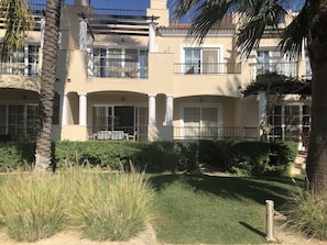 Front of apartment looks directly onto the resort pool