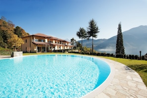 Relax in the huge pool here at "Tremezzo Residence" no 6