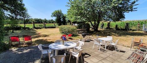 Rear south facing patio with nice view over garden and fields great for relaxing