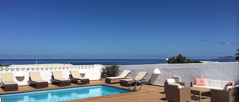 Pool area overlooking the Famara Beach 