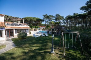 Front view of Villa, 8 sun loungers, double swing set. south facing
