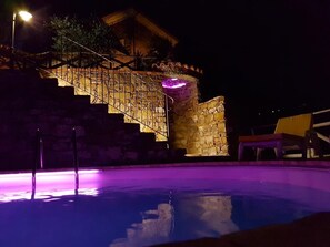 Private panoramic swimming pool at night
