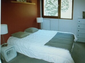 Bedroom separate from living room and kitchen