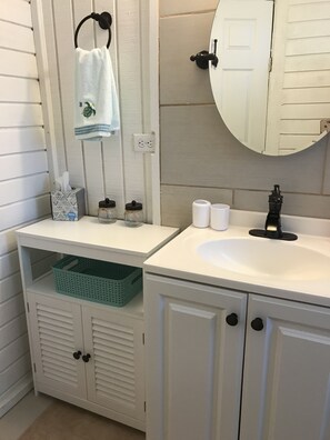 Bathroom #1 with stall shower, toilet and sink 