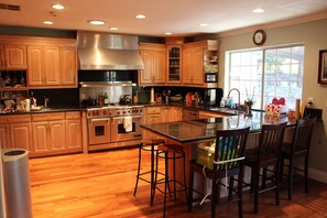 Gourmet Kitchen setup with commercial grade Wolf range and hood