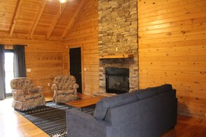 Cozy living room with gas fireplace, smart tv and satellite.
