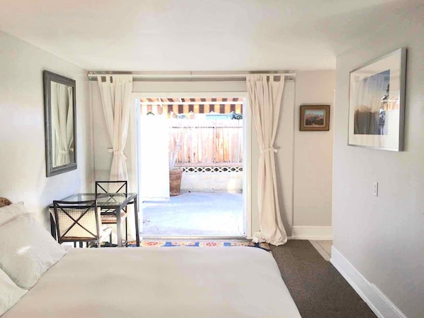 Studio, with queen bed, large french doors open to spacious private patio. 