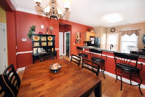 Dining room with seating for 6 and 3 additional bar stools