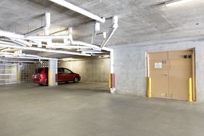 Temporary parking area with garbage/recycling room door. Key provided to enter. 
