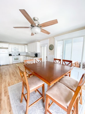 Kitchen with table that seats 8, and extends to seat 12. 