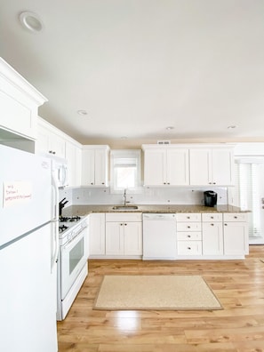 Fully stocked kitchen with all new cabinets, granite countertops. 