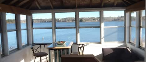 10 windows in the spectacular veranda sunroom plus the new ceiling fan & light 