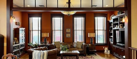 Living room -- with a smart TV and built in surround sound --overlooks Main St.