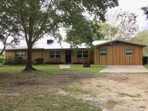 Front of House features board and batten siding 