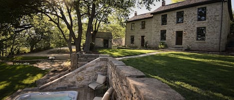 Native limestone buildings and terraces nestled into the country hillside.