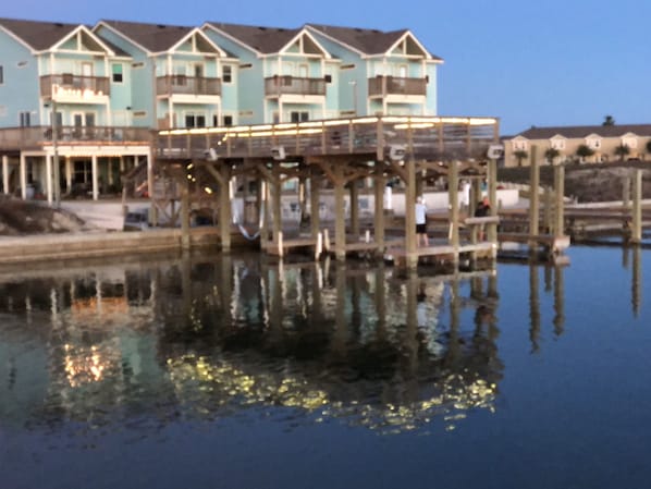 A view of condos from the water, our BACKYARD..Lake Padre. Minutes to the Gulf