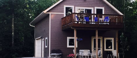 Front of house with oversized deck facing the lake.