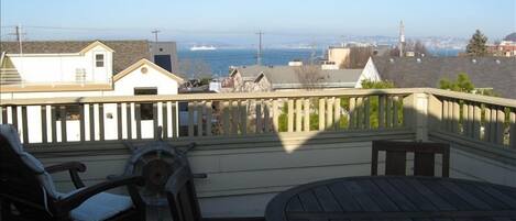 Rooftop deck view of the Sound and ferries.  Alki beach 1/2 block away.